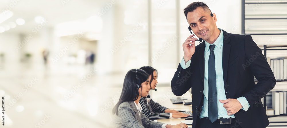 Business people wearing headset working in office to support remote customer or colleague. Call cent