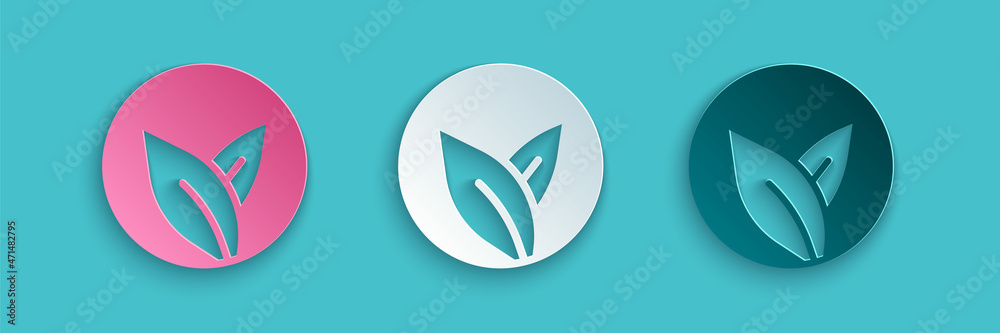 Paper cut Tea leaf icon isolated on blue background. Tea leaves. Paper art style. Vector