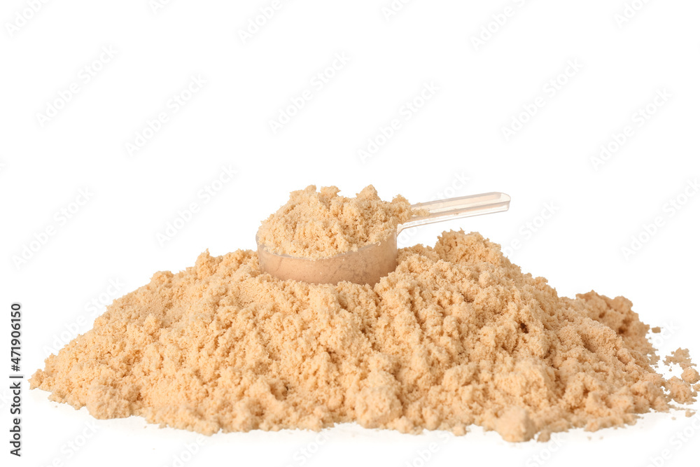 Heap of protein powder and measuring scoop on white background