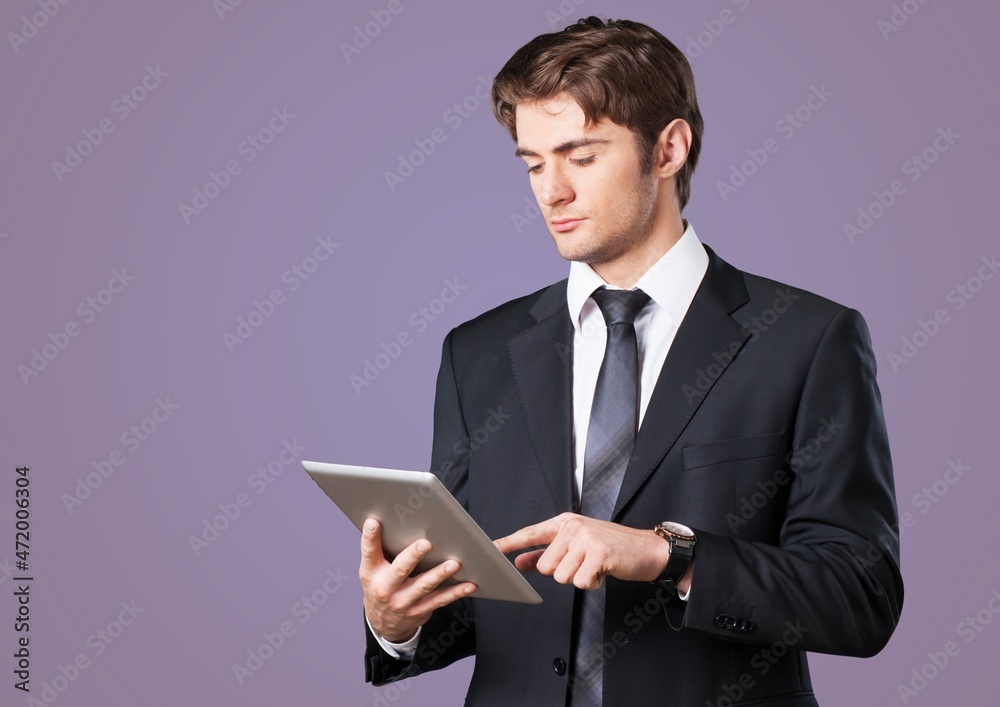 Young cool student in casual clothes use work on tablet pc computers