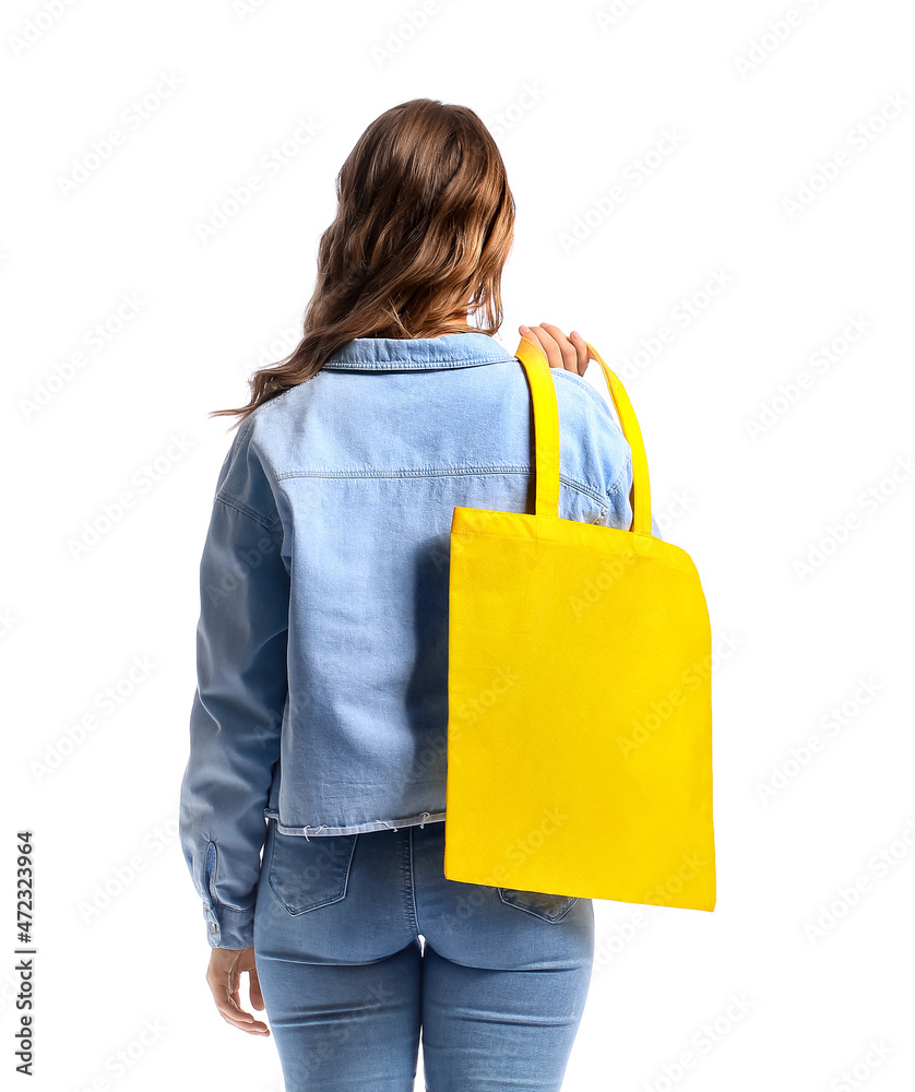 Young woman with yellow eco bag on white background