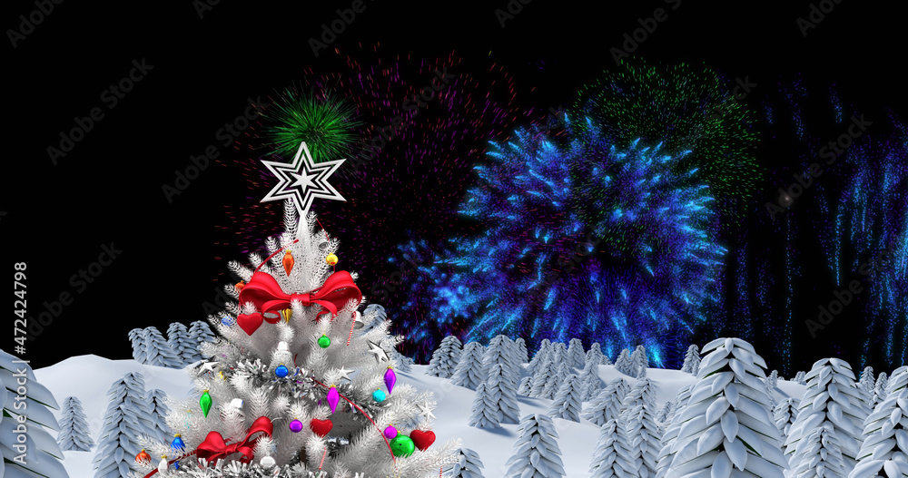 Image of decorated white christmas tree with fireworks exploding in night sky