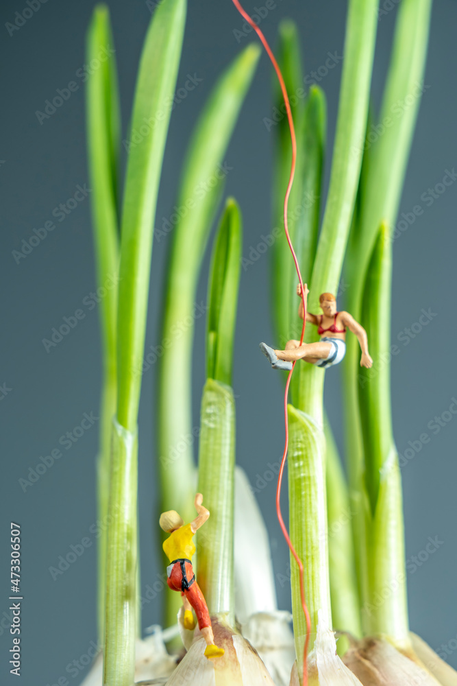 Little man crawling on vegetables