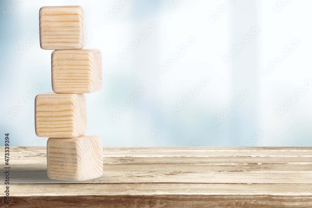 Business goals in 2022. Flips wooden cubes on a beautiful background. For starting business plan nex