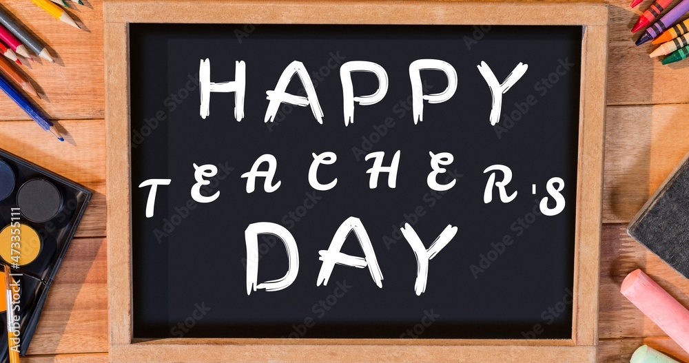 Composite image of happy teachers day text on writing slate with school supplies