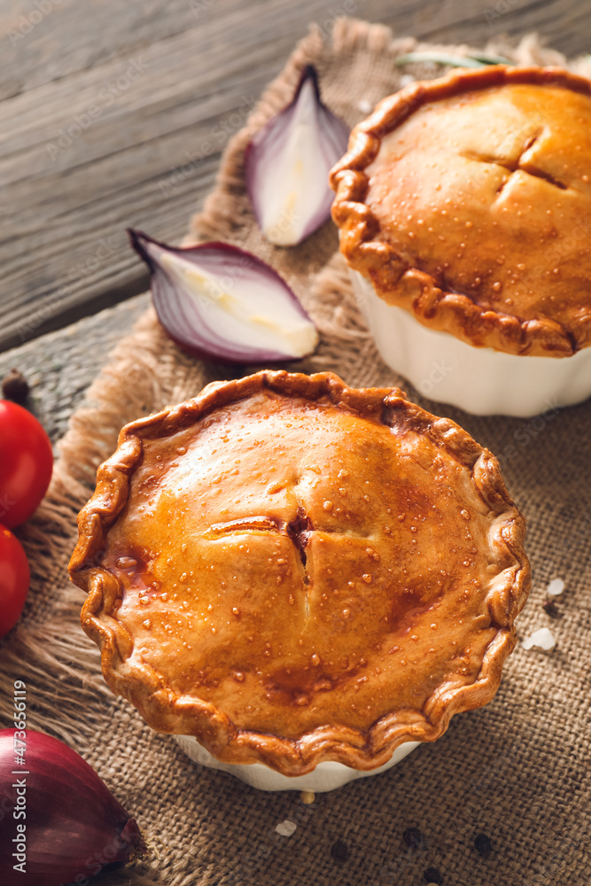 Tasty beef pot pies on table