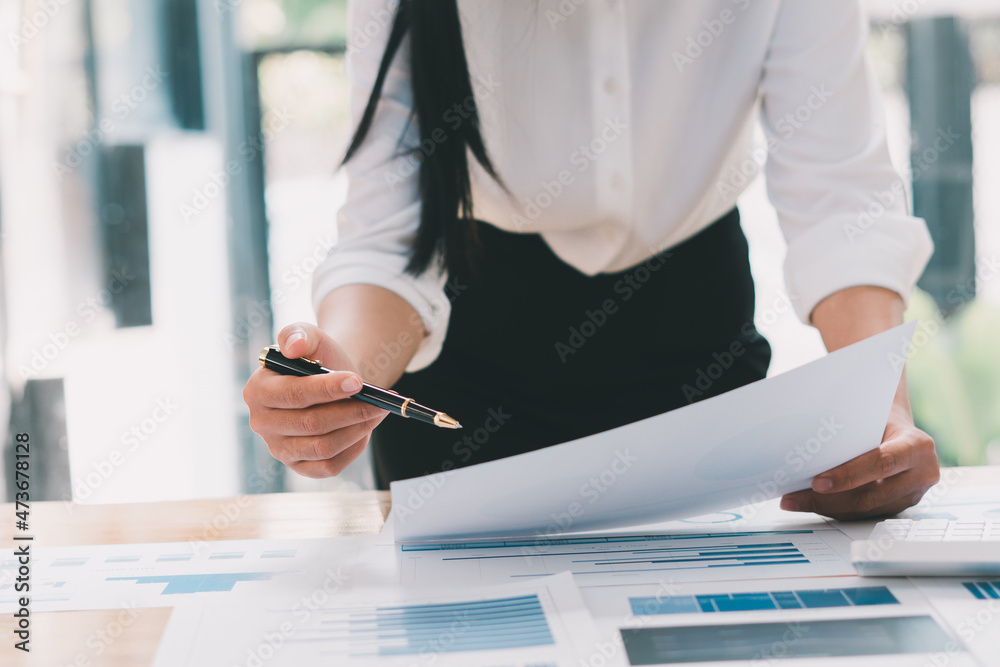 Financial inspector calculating a numbers in office room.