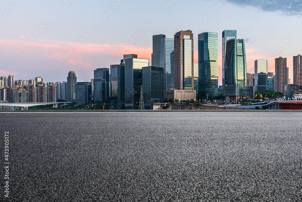 Panoramic skyline and modern commercial office buildings with empty road. Asphalt road and cityscape