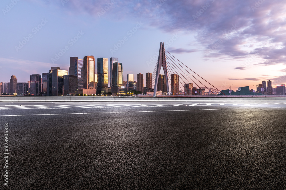 Panoramic skyline and modern commercial office buildings with empty road. Asphalt road and cityscape