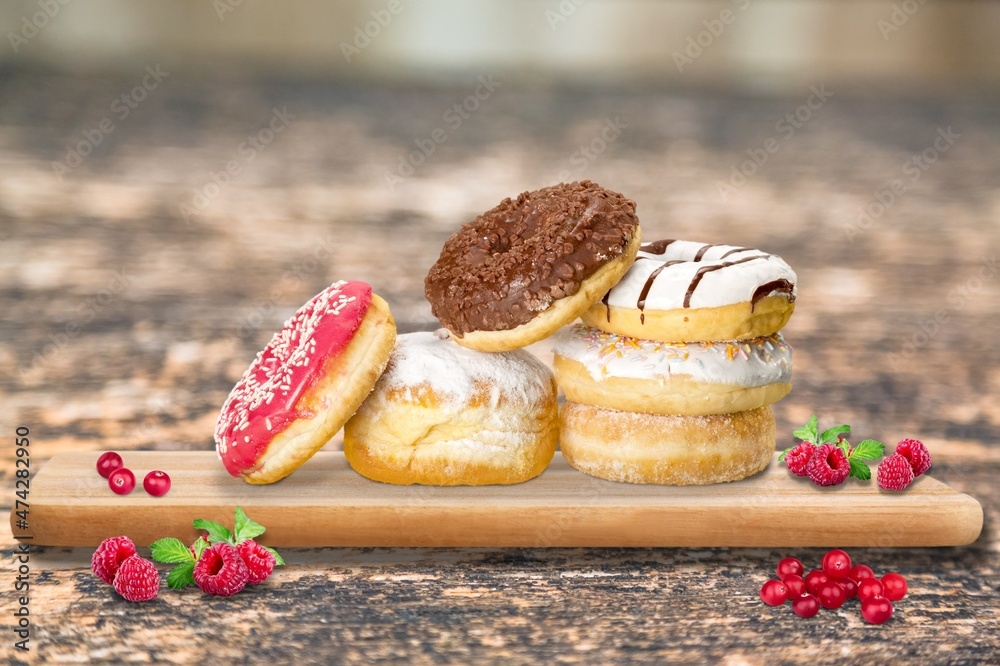 Hanukkah sweet food doughnuts sufganiyot with powdered sugar and fruit jam. Jewish holiday Hanukkah 