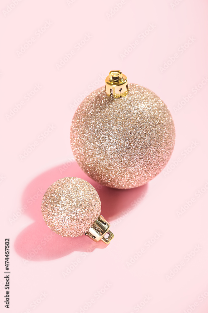 Bright Christmas balls on pink background