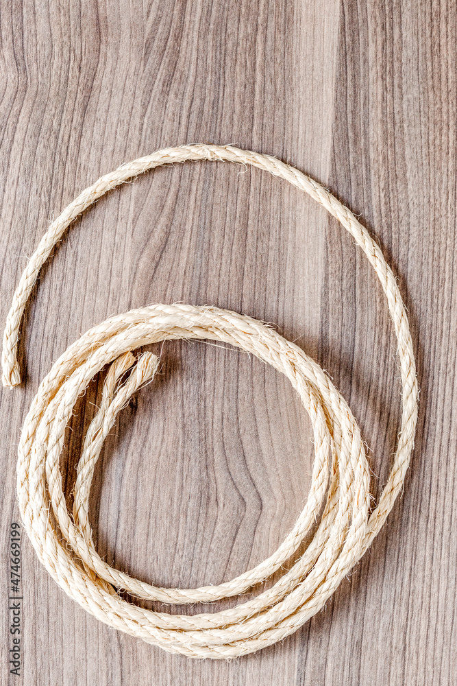 rope coiled on a wooden table