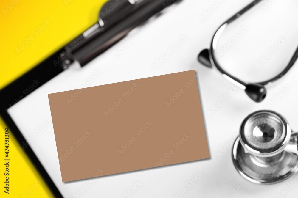 Medical concept. A card with stethoscope on the desk