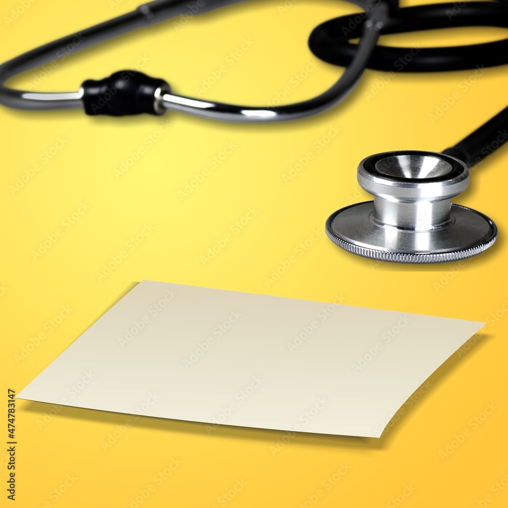 Medical concept. A card with stethoscope on the desk