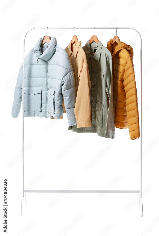 Rack with stylish jackets on white background