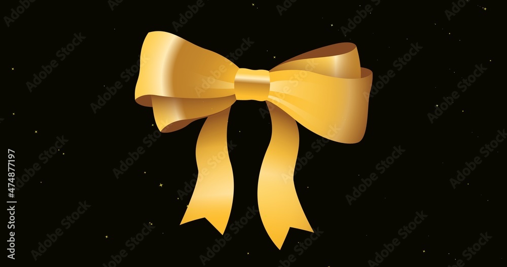 Close-up of golden bow with copy space over abstract black background