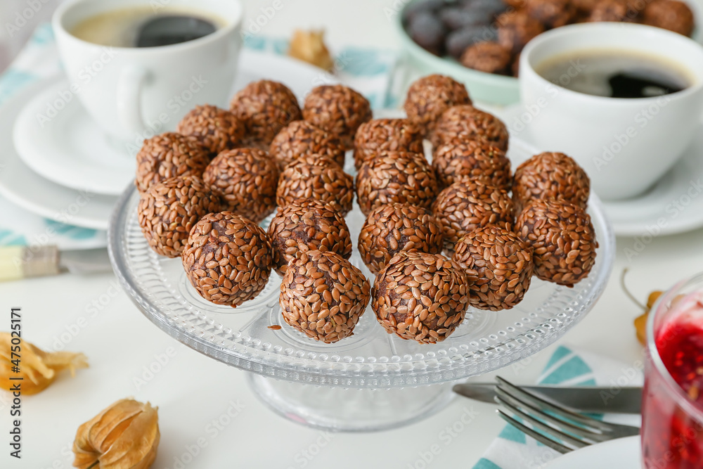 Stand with tasty flax seed candies on table