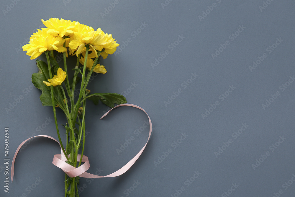 Yellow chrysanthemum flowers on dark background