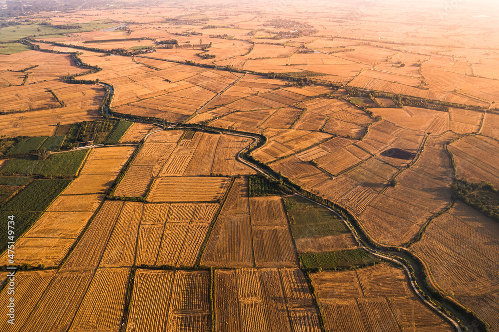 Agricultural barren fields with irrigation canal in farmland at countryside