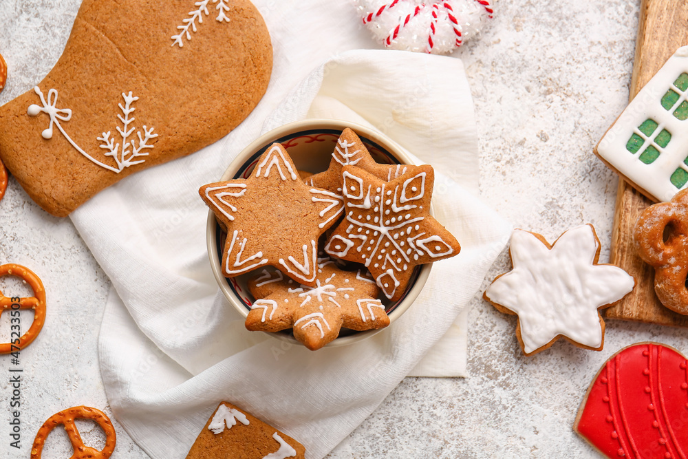 Composition with tasty gingerbread cookies on light background