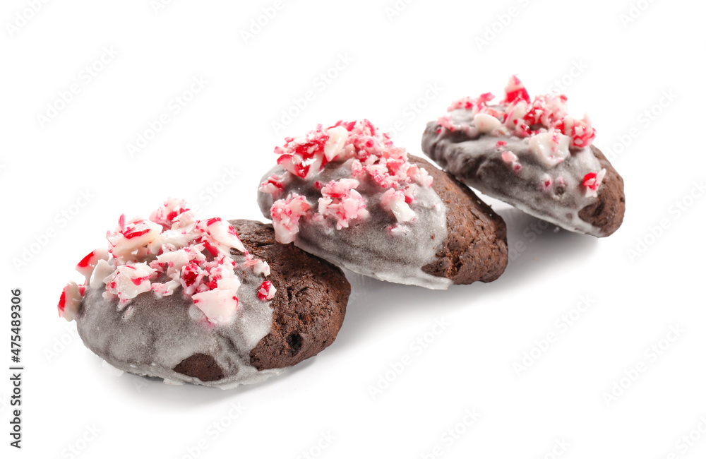 Tasty candy cane cookies on white background