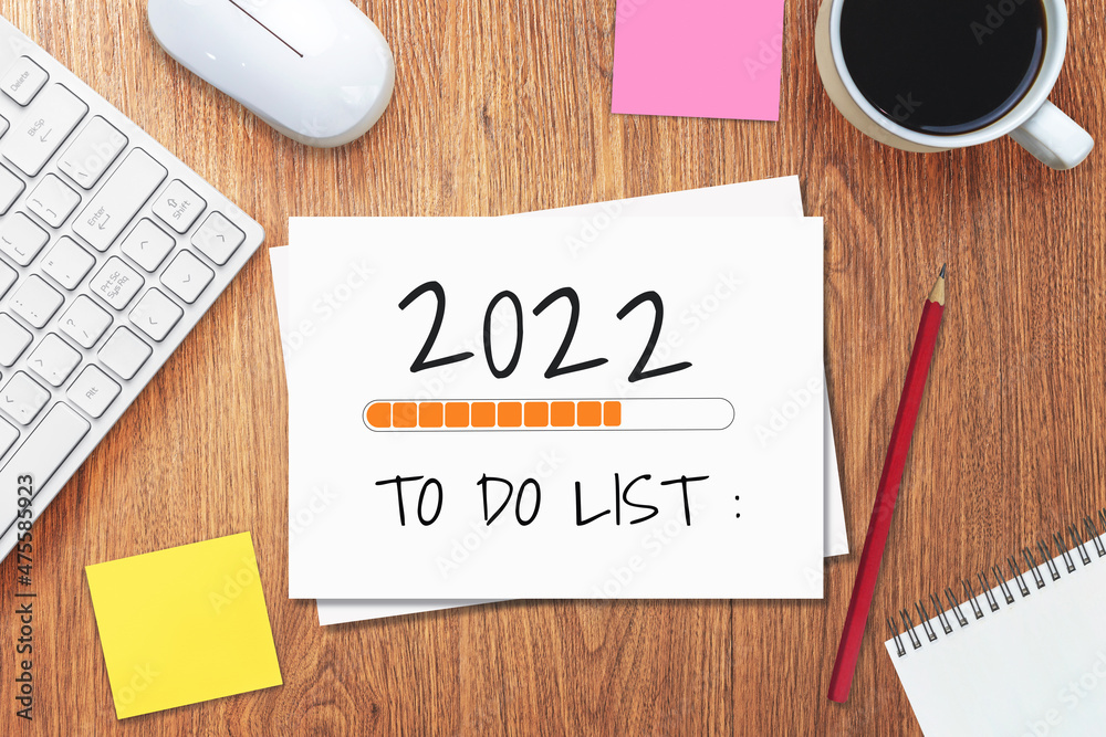 2022 Happy New Year Resolution Goal List and Plans Setting - Business office desk with notebook writ