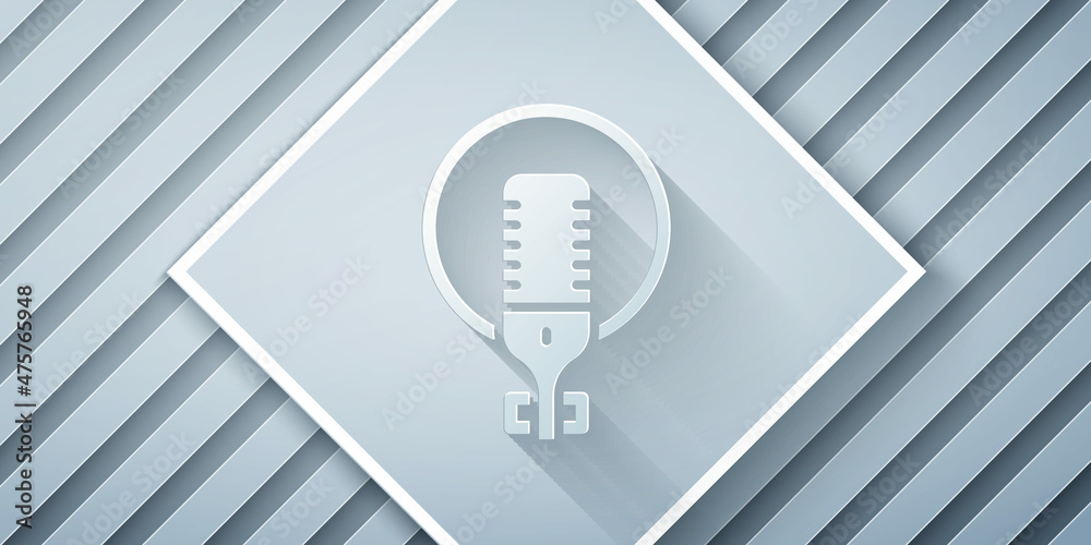 Paper cut Microphone icon isolated on grey background. On air radio mic microphone. Speaker sign. Pa