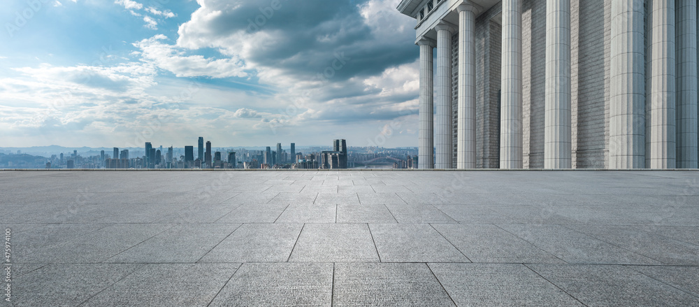 Empty floor with modern city skyline and buildings