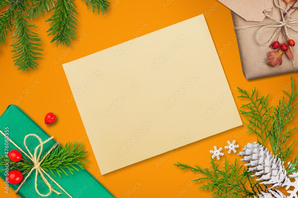 Christmas blank greeting card mock-up scene. Festive winter composition. Craft envelope, pine cone, 