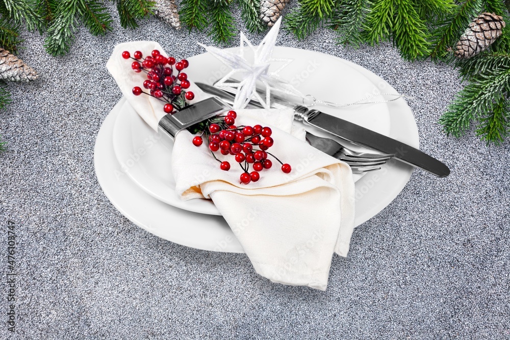 Modern Christmas Table Setting With Plate And Cutlery.