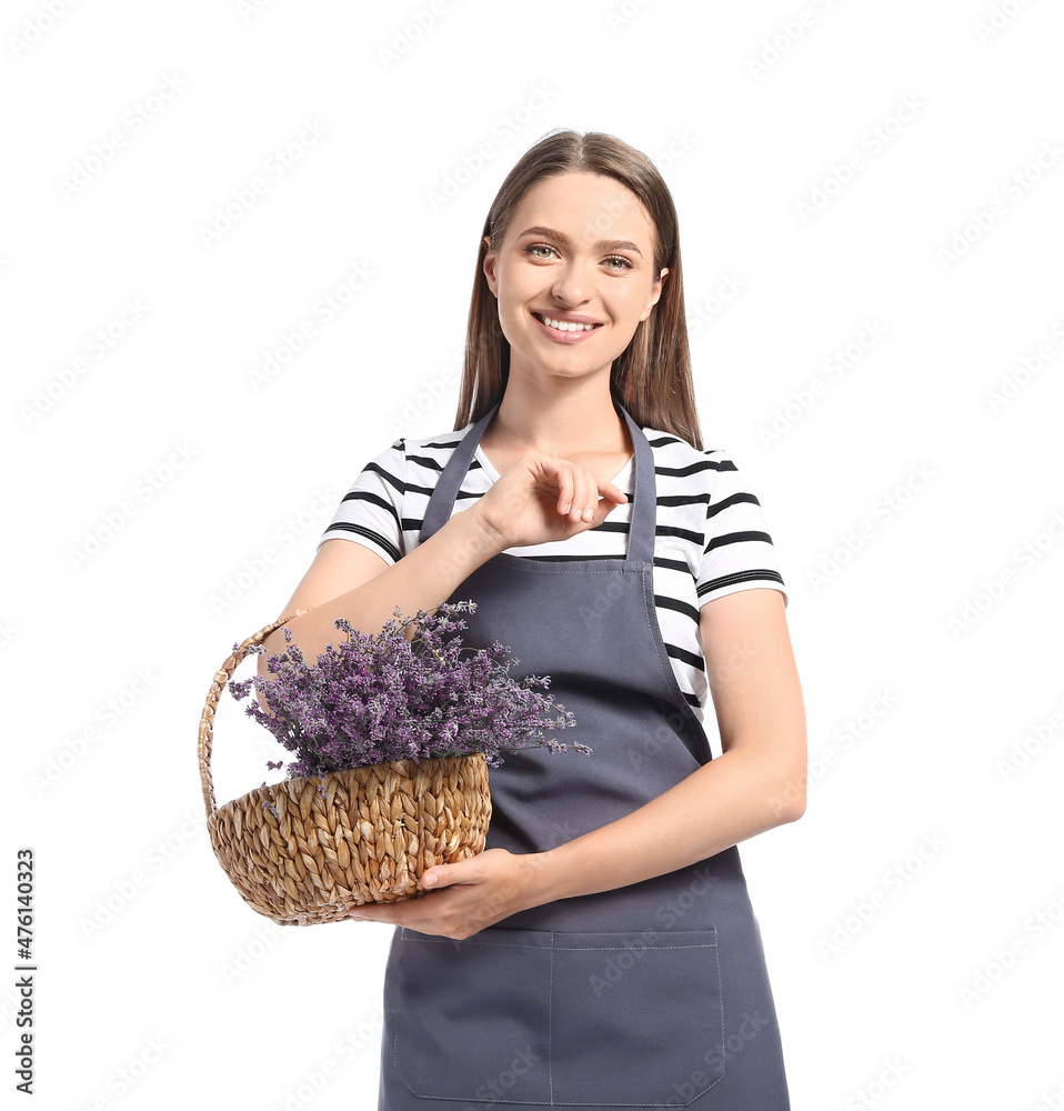 Female gardener with basket of lavender on white background