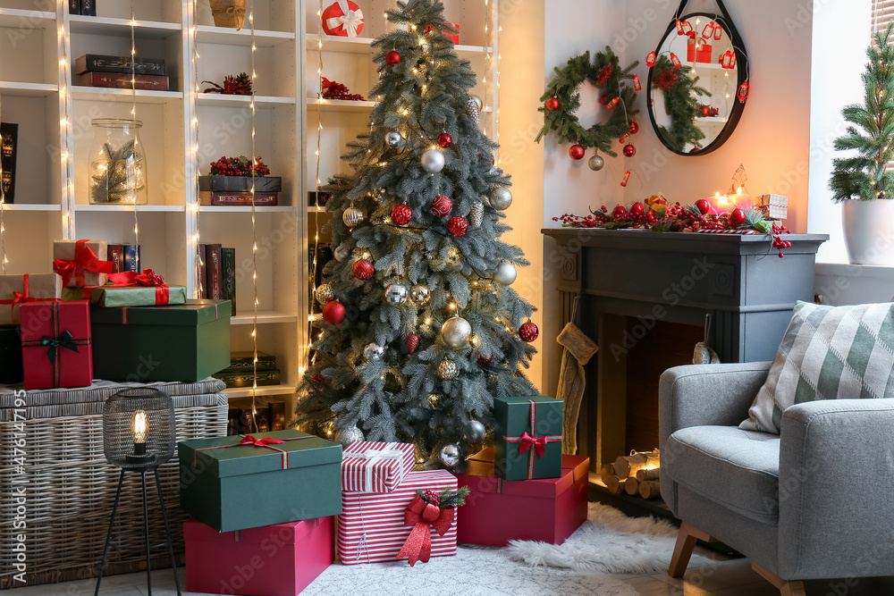 Interior of living room with fireplace and Christmas tree