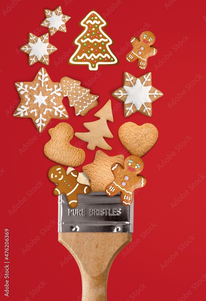 Creative Christmas concept composition. Paint brush with Holliday cookies