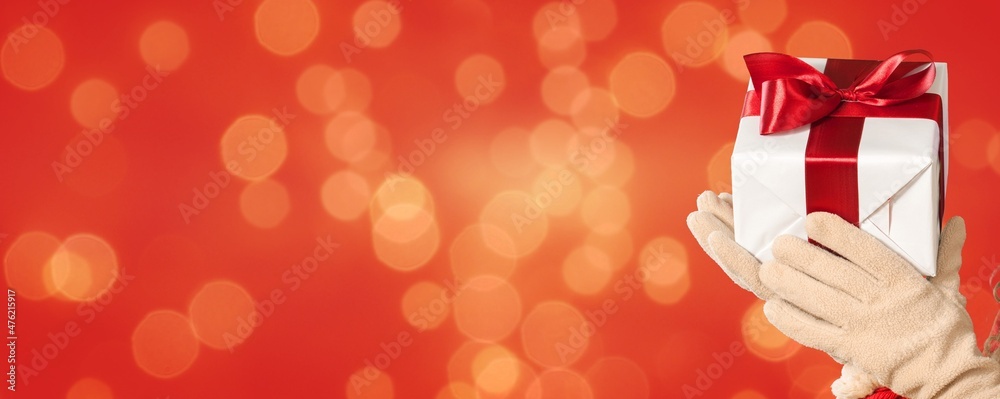 Santa Claus Give Handmade Present In Red Background - Christmas