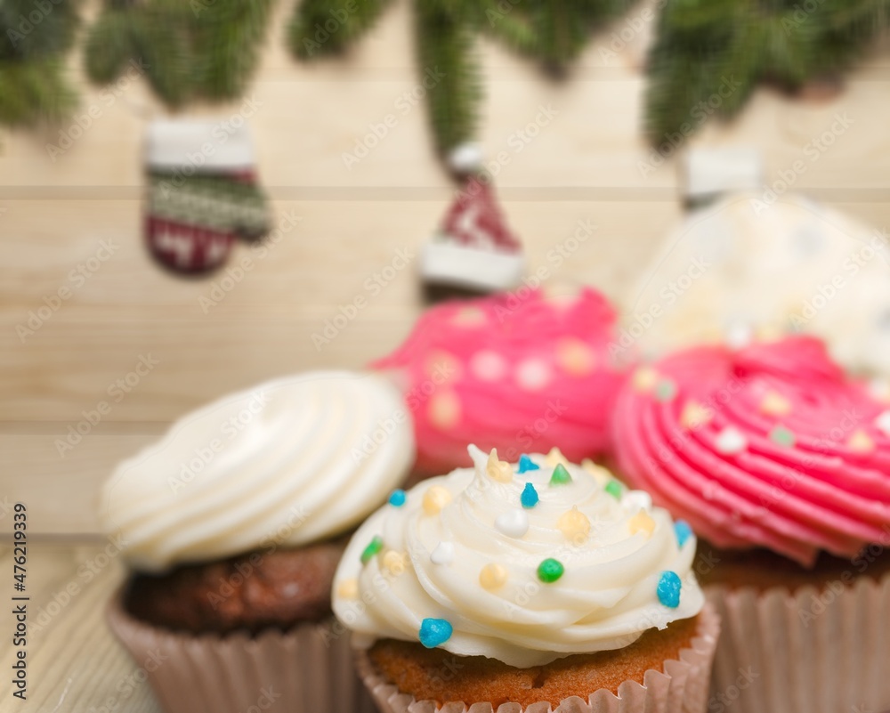 Christmas cakes, puddings or cupcakes on kitchen desk