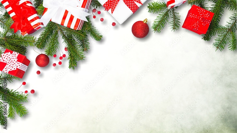 Christmas mood border of gifts, green fir, gold decorations on background.