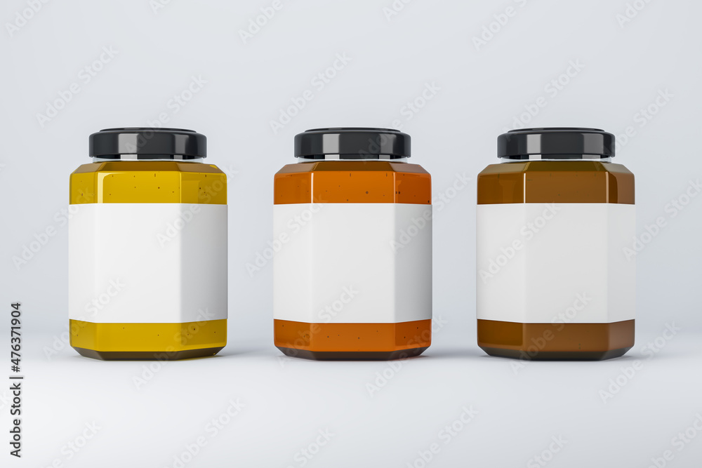 Empty label honey jars on light background. Product packaging, sales and marketing concept. Mock up,