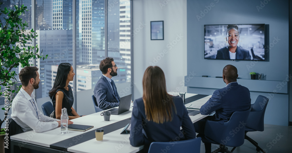 Video Conference Call in Office Meeting Room: Black Female Executive Talks with Group of Multi-Ethni