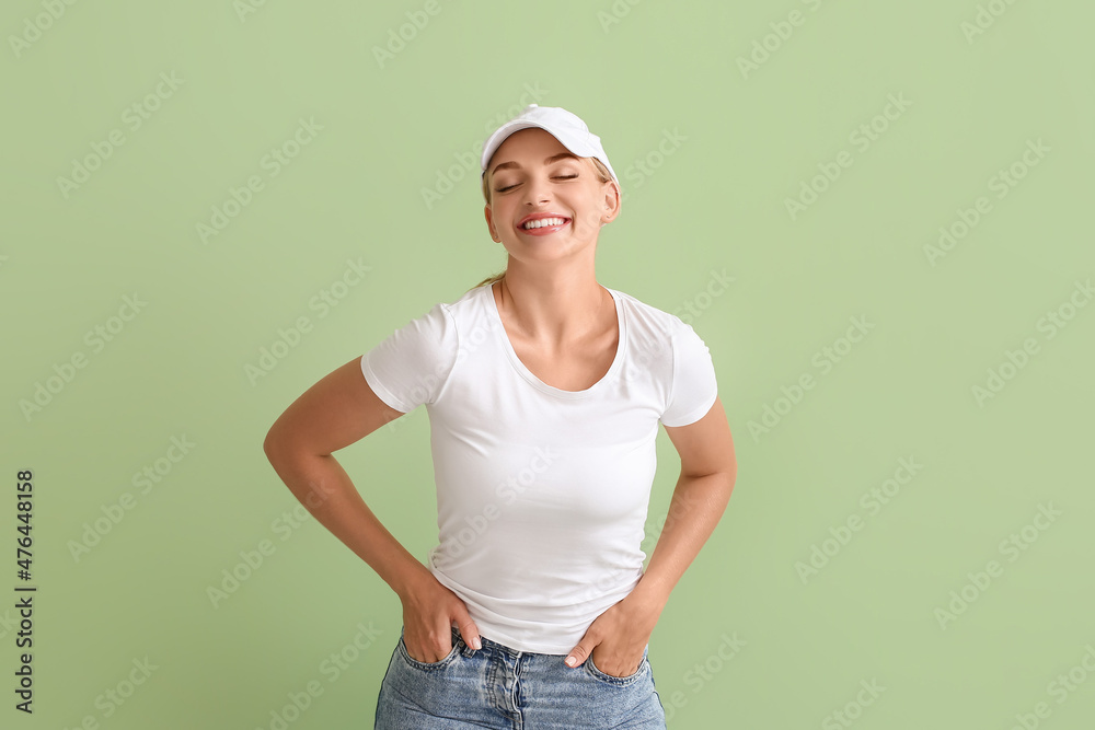 Fashionable young woman on color background