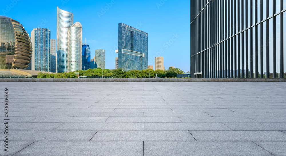 Panoramic skyline and modern commercial office buildings with empty square floors