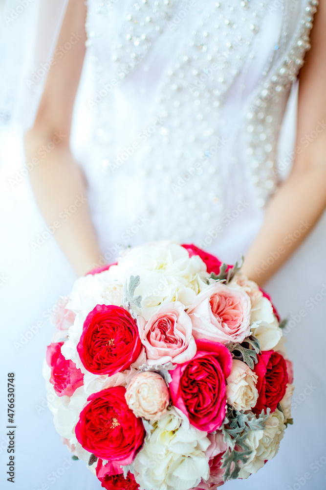 Bride holding bouguet of flowers