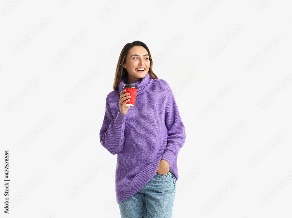 Beautiful woman with cup of coffee on white background