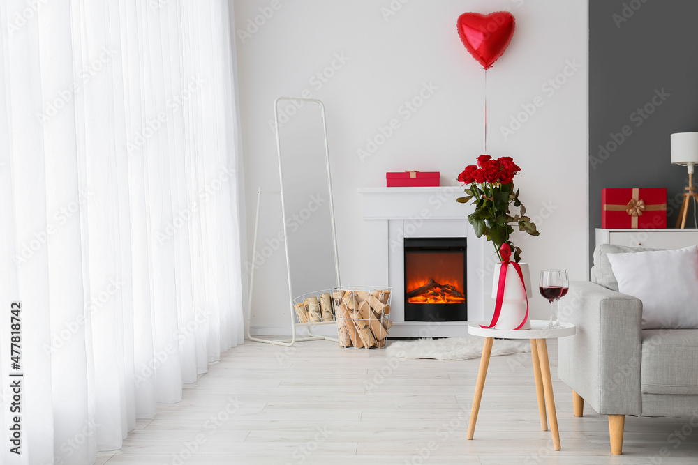 Interior of living room with fireplace and decor for Valentines day