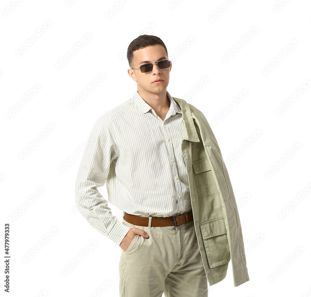 Young man in stylish shirt and jacket on white background