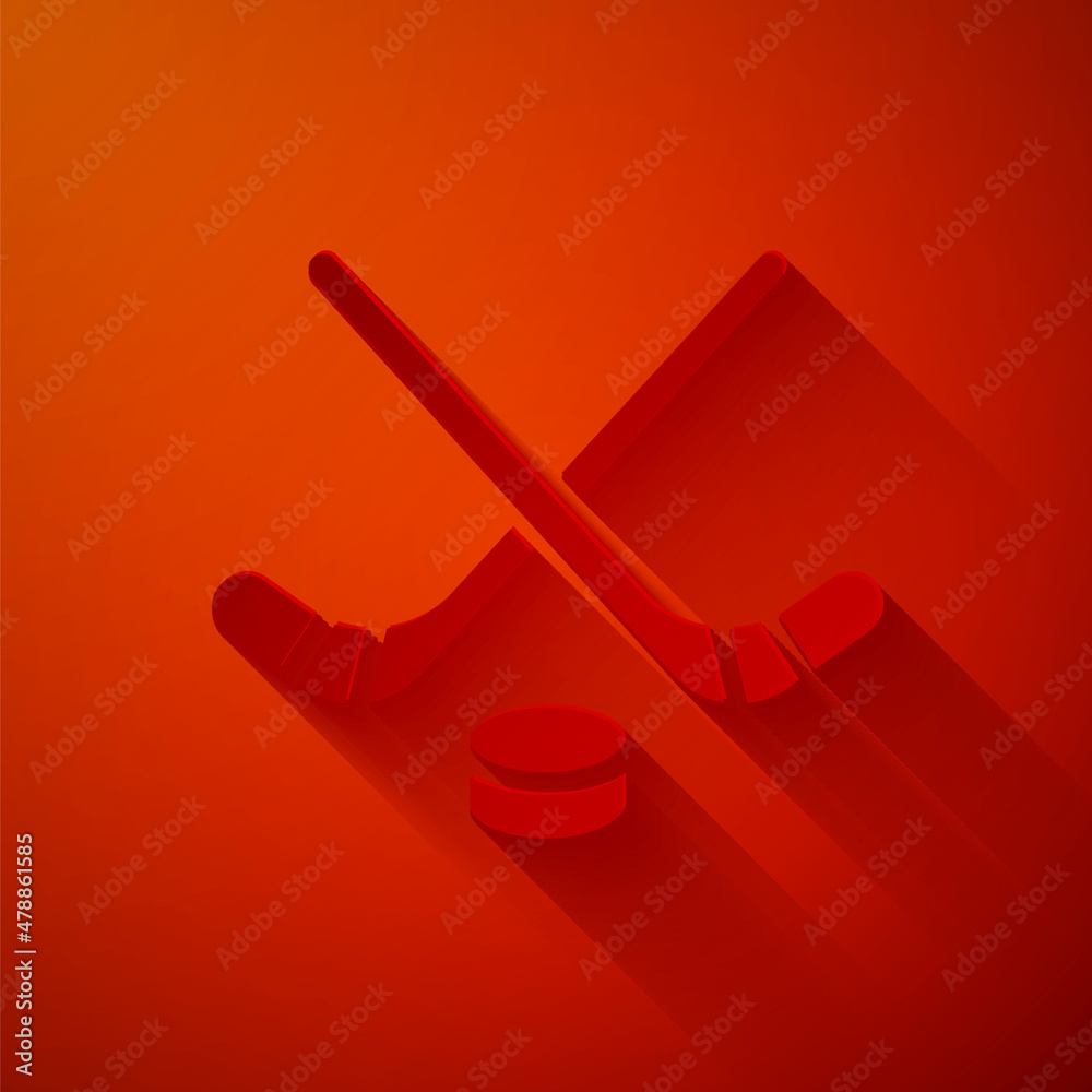 Paper cut Ice hockey sticks and puck icon isolated on red background. Game start. Paper art style. V