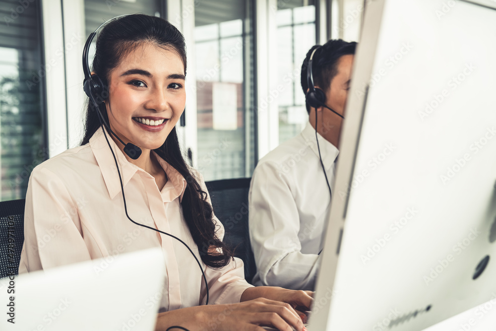 Business people wearing headset working actively in office . Call center, telemarketing, customer su