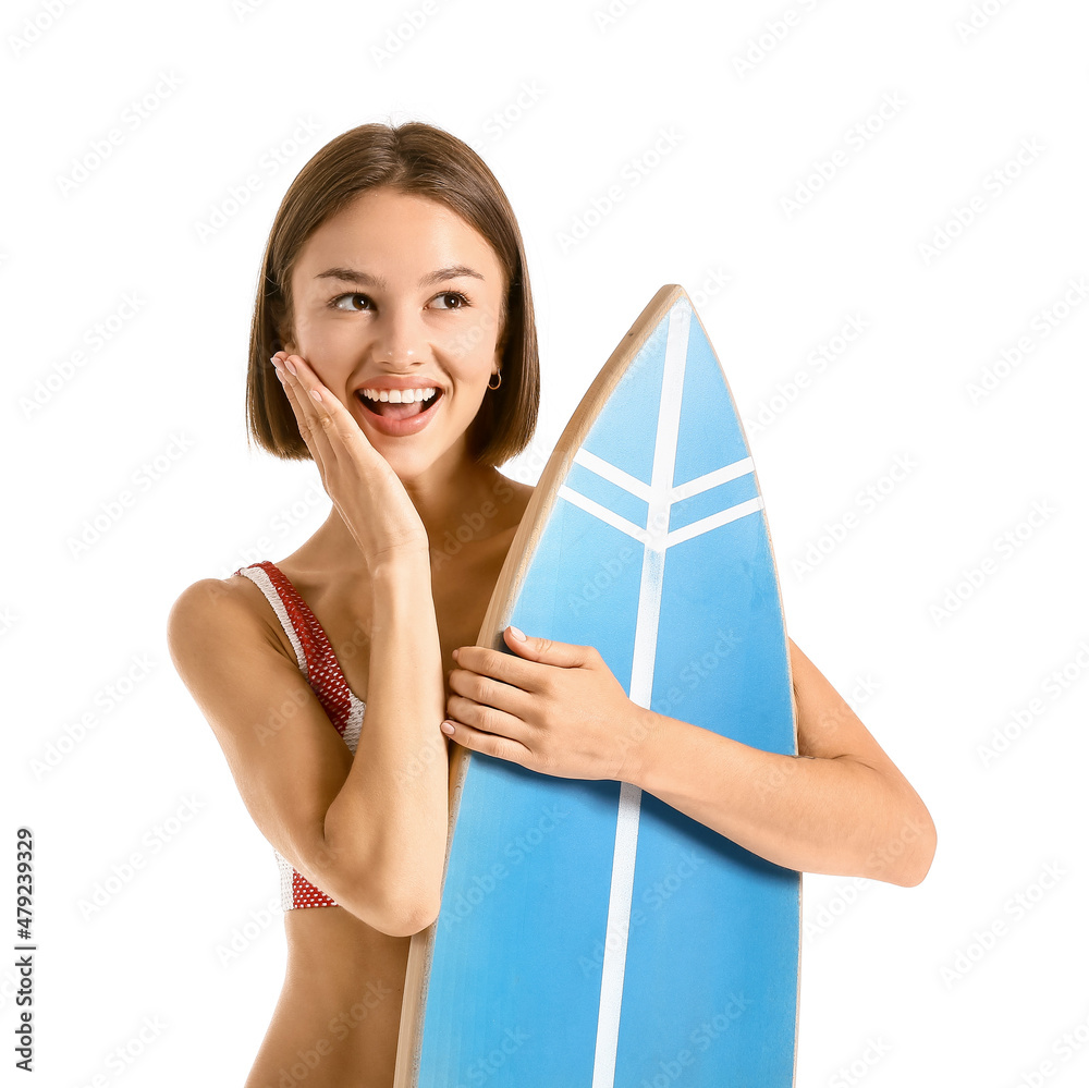 Beautiful young woman with surfboard on white background