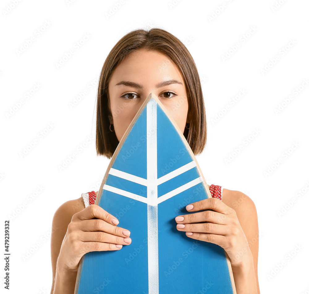 Beautiful young woman with surfboard on white background