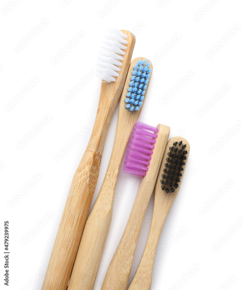 Bamboo toothbrushes on white background