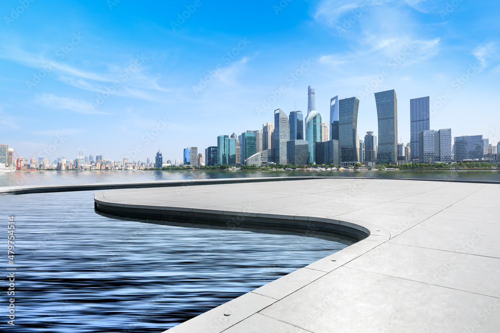 Panoramic skyline and modern commercial buildings with empty floor in Shanghai, China.